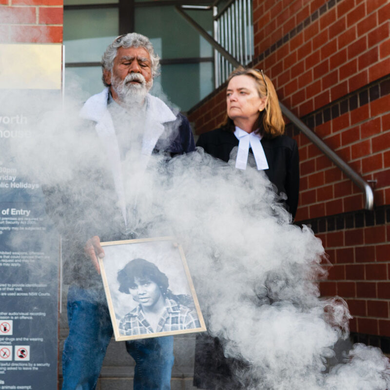 Uncle Don ‘Duck’ Craigie and deputy state coroner Harriet Grahame during a smoking ceremony. Picture: AAP.